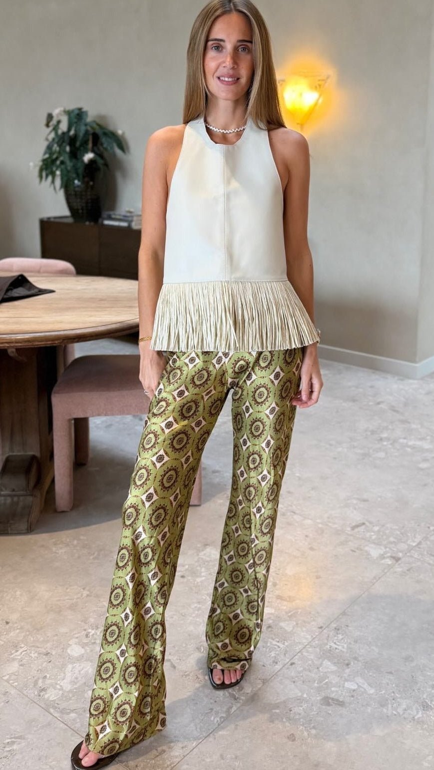 Gina halterneck-topp i imitert skinn med frynser