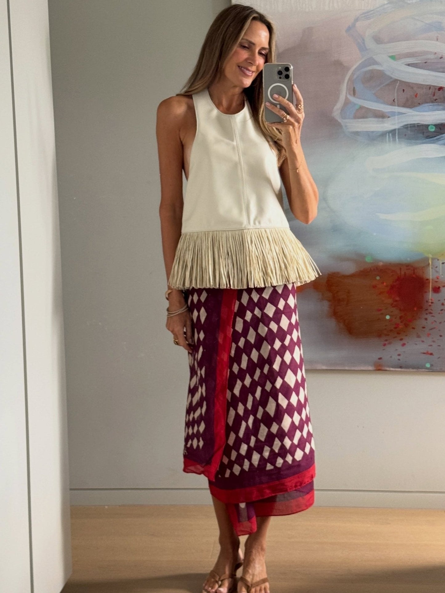 Gina halterneck-topp i imitert skinn med frynser