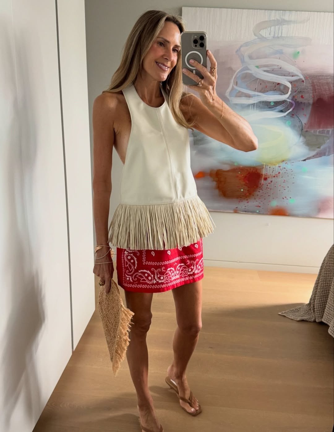 Gina halterneck-topp i imitert skinn med frynser